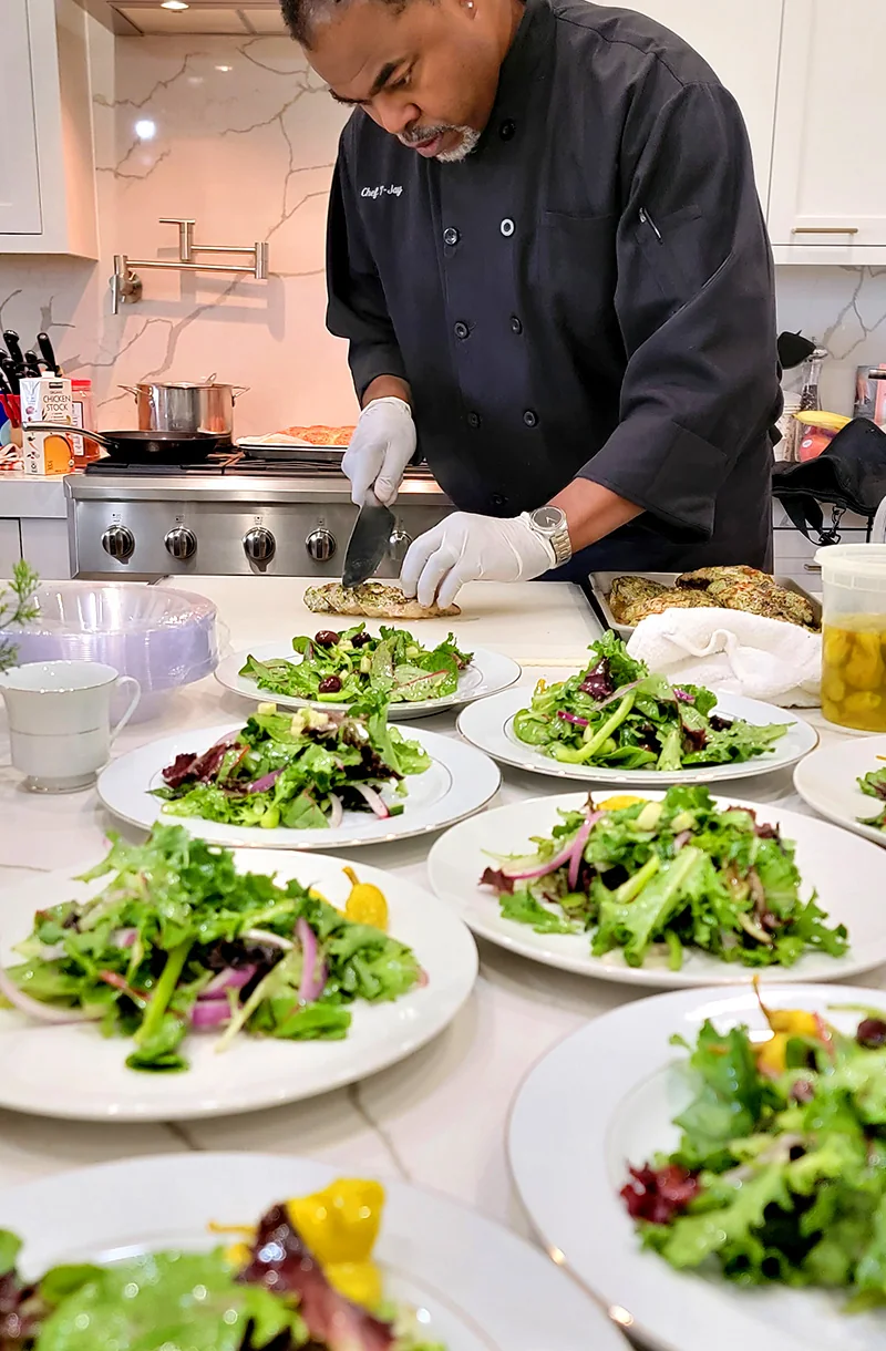Chef TJay preparing fresh food for a custom meal plan